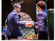 Первым Ян Непомнящий (слева) принял поздравления от единственного шахматиста, которому уступил на Турнире претендентов - Максима Вашье-Лаграва. Фото: Lennart Ootes / FIDE